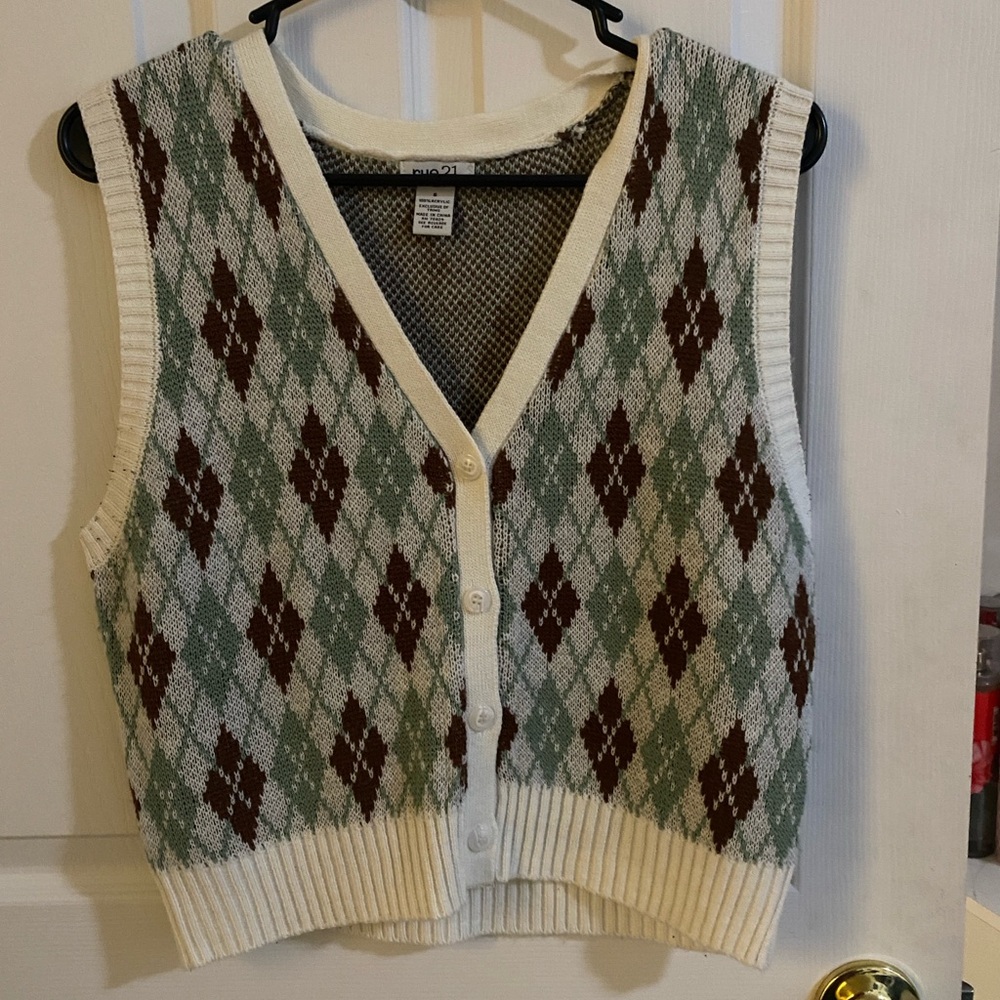 This is a sweater vest. Blue/green and brown colors from rue 21